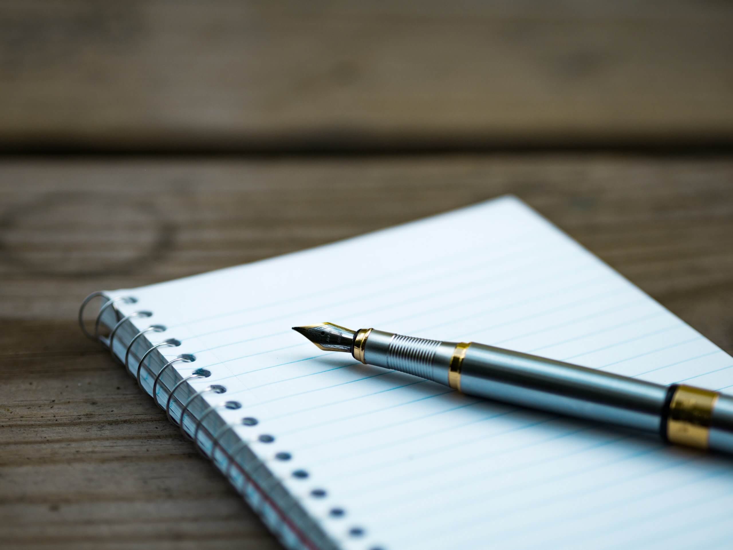 image of a fancy pen and notebook