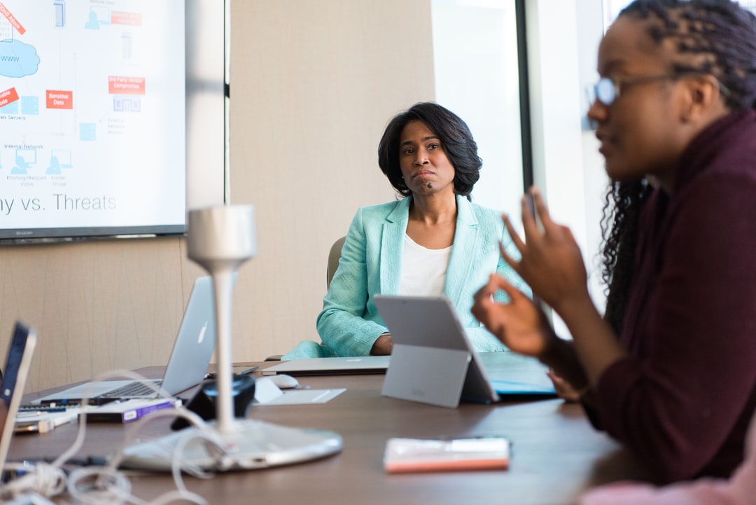 Two women participating in a video conference.